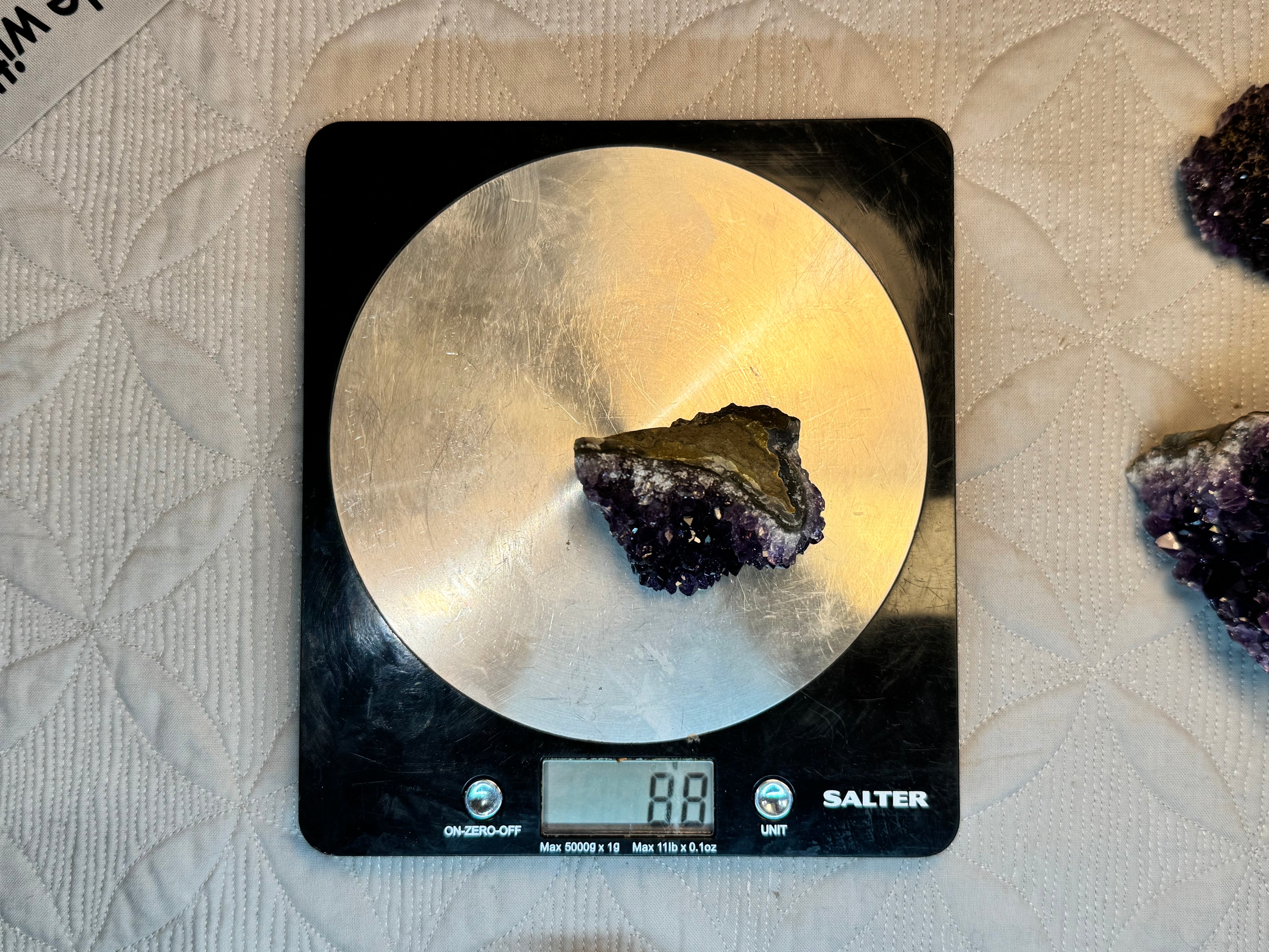 Mineral on a digital kitchen scale with 'Salter' branding on a textured surface.