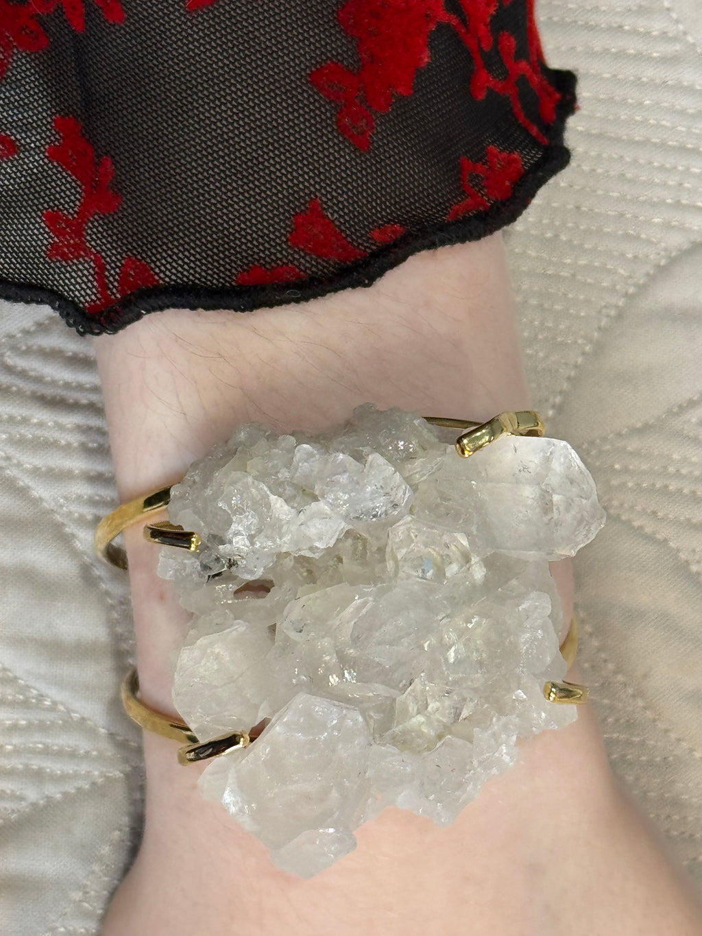 Crystal bracelet on a wrist with a textured background