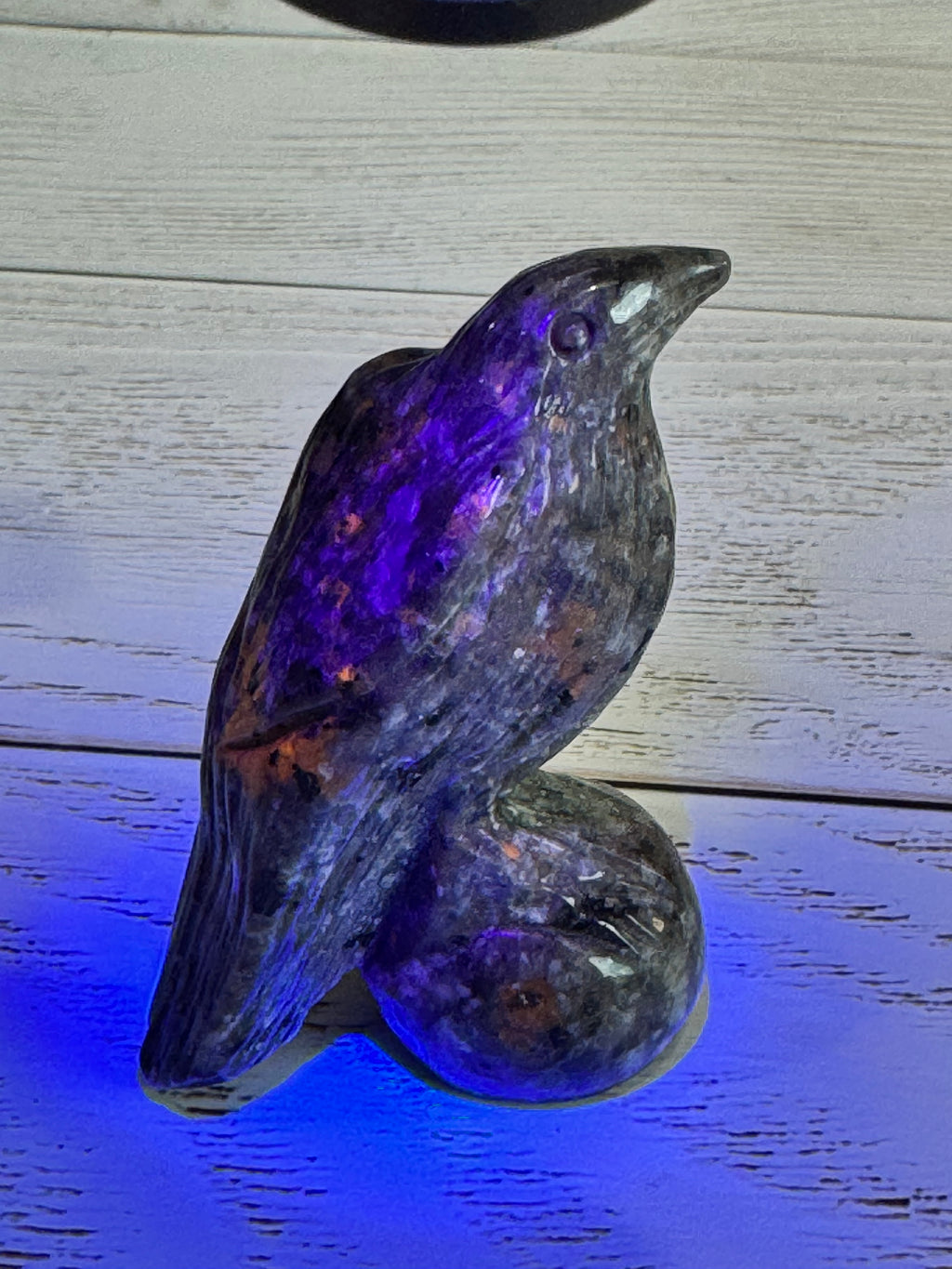 Yooperlite Raven Crystal Carving, UV reactive.
