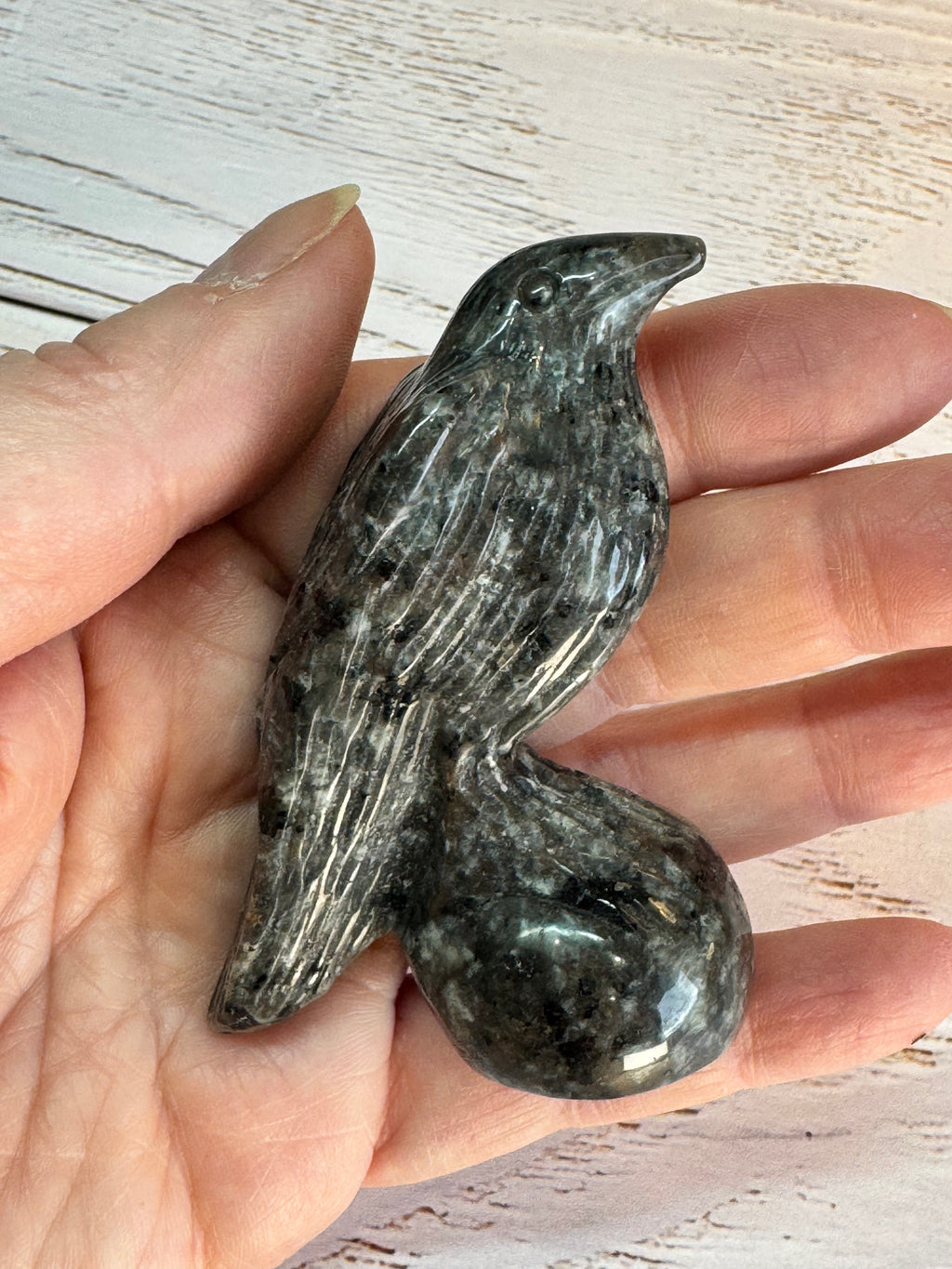 Yooperlite Raven Crystal Carving, UV reactive.