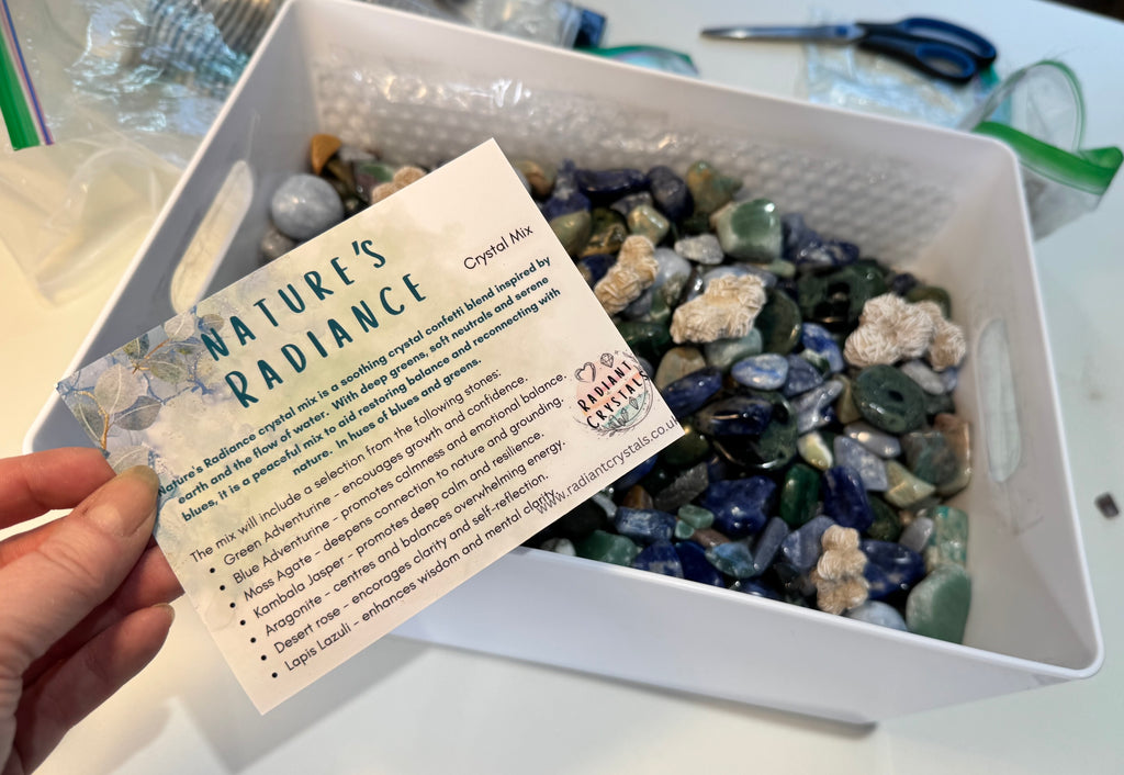 Box of assorted crystals with a 'Nature's Radiance' card on a white surface.