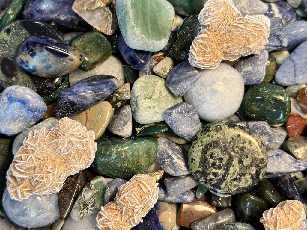 Close-up of colorful pebbles with various textures and colors