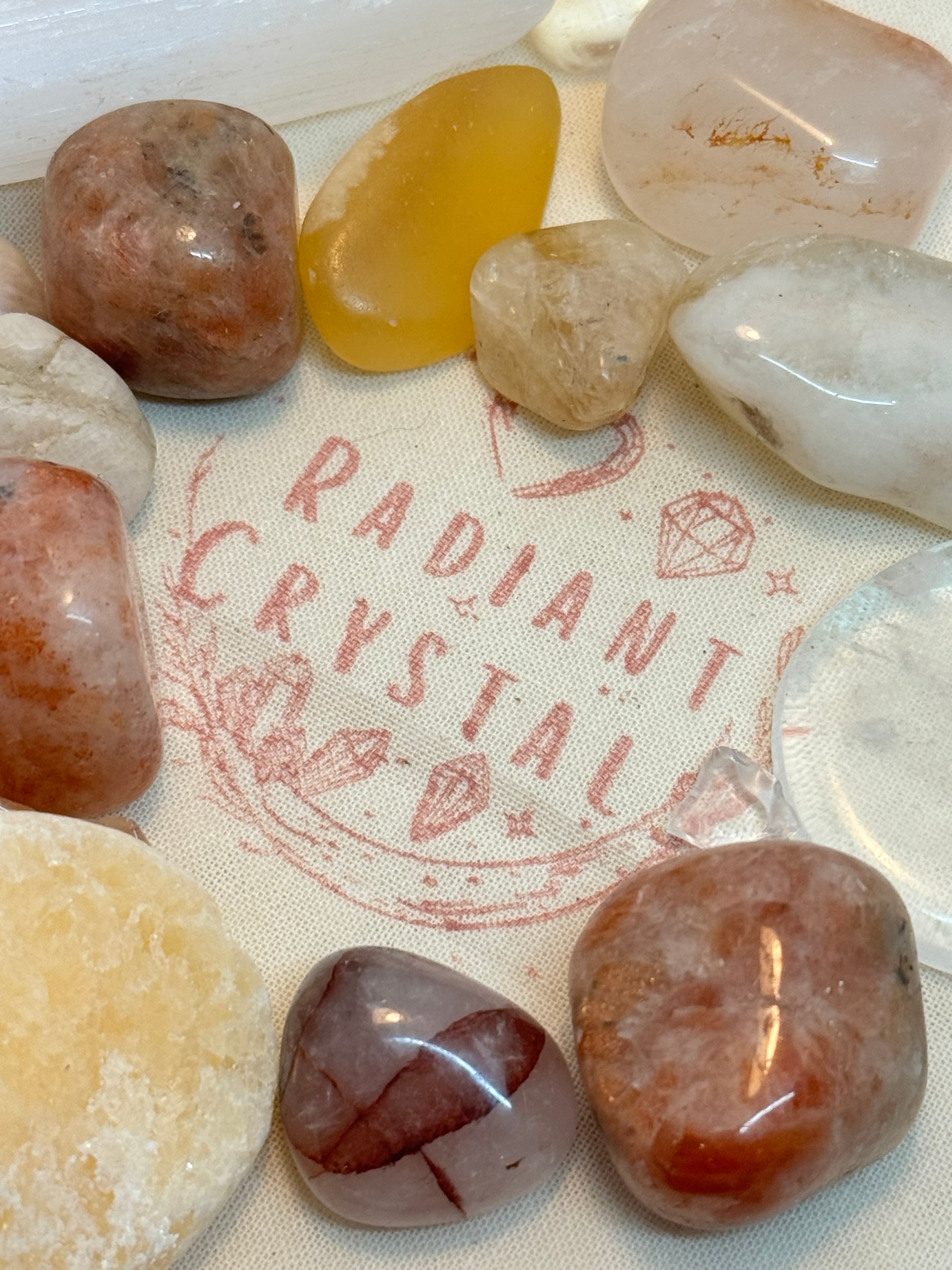 crystal tumble stones on a cotton bag with Radiant Crystals logo