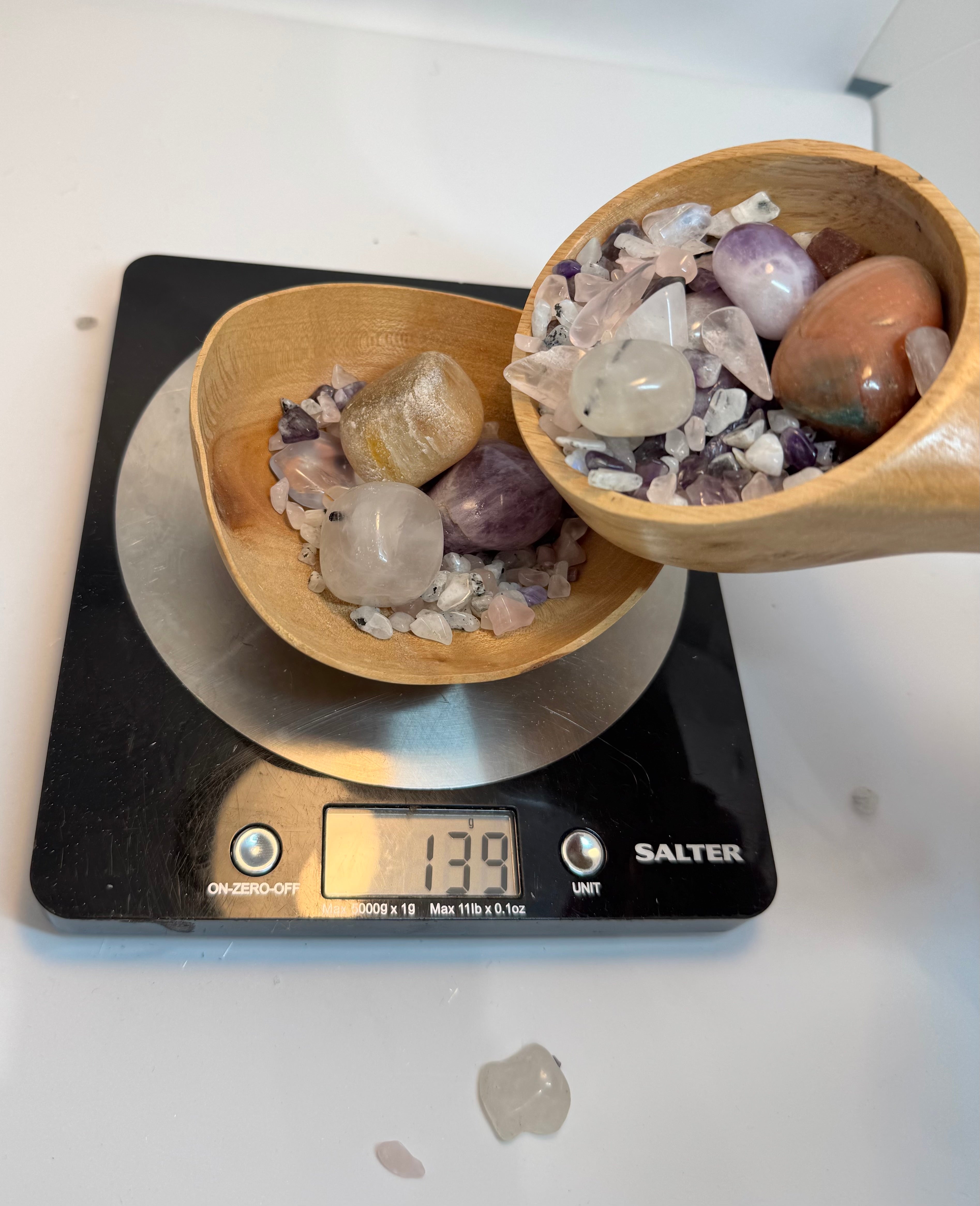 wooden bowl filled with rocks on a Salter kitchen scale.