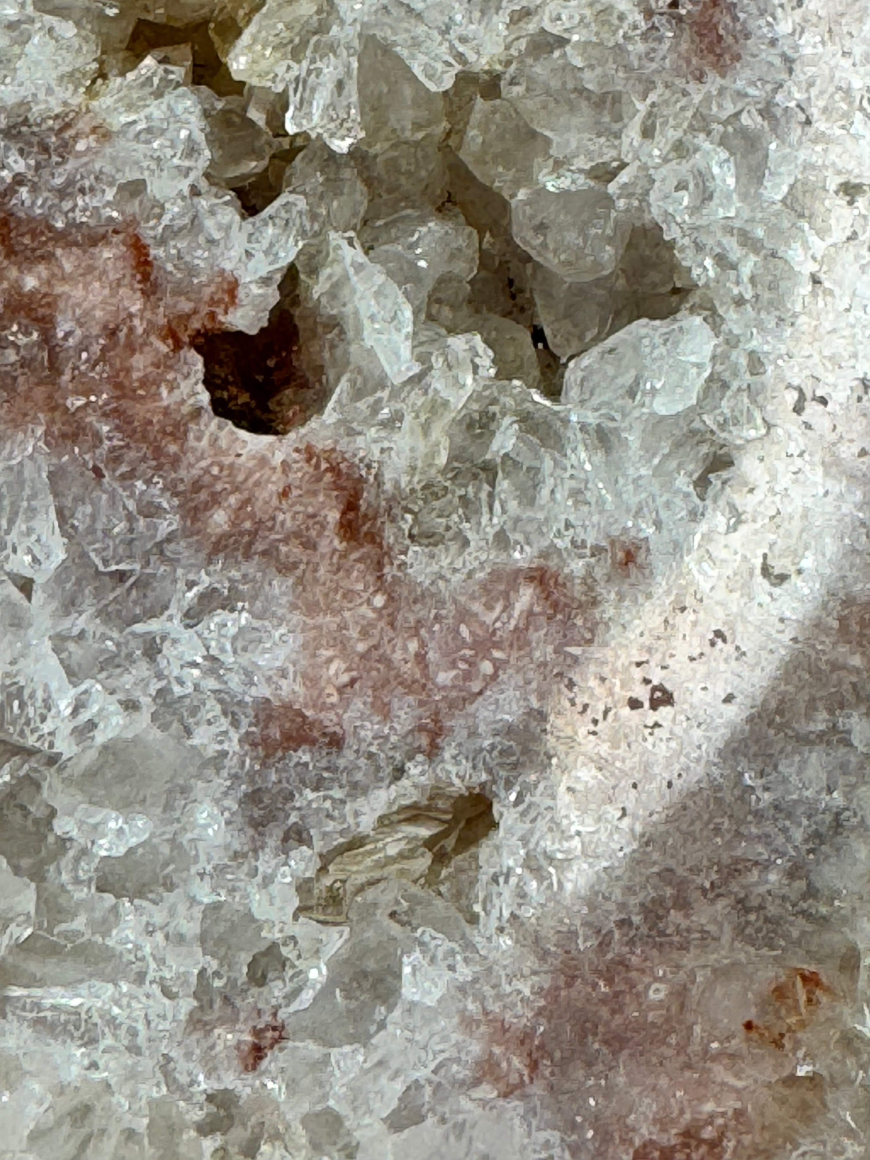 Close-up of a crystal formation with a mix of white and brown colors.