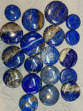 Collection of blue and gray stones on a textured surface