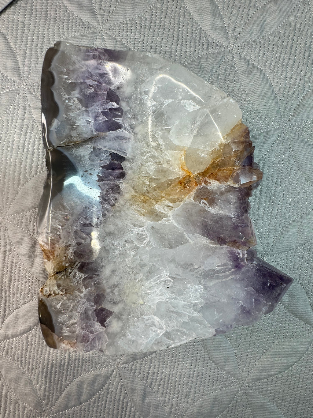 Crystal rock bowl on a textured fabric background