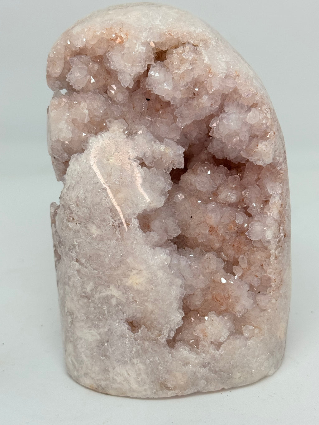 Pink Geode crystal on a light gray background