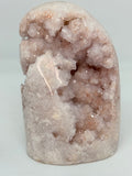Pink Geode crystal on a light gray background