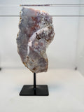 Geode on a stand against a white background