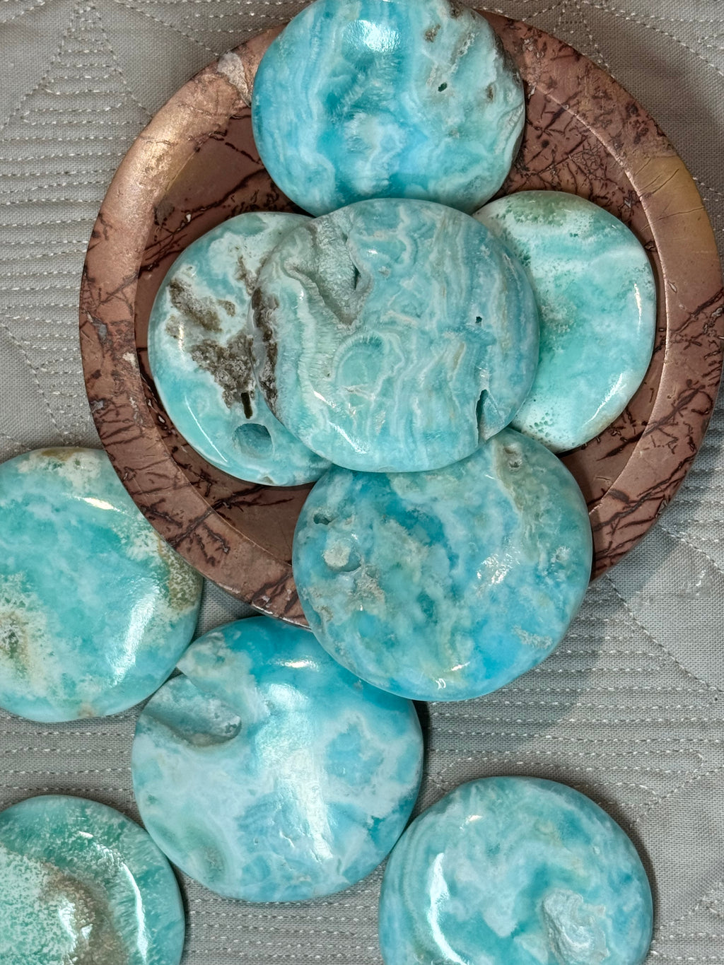 round Turquoise stones on a textured  bowl
