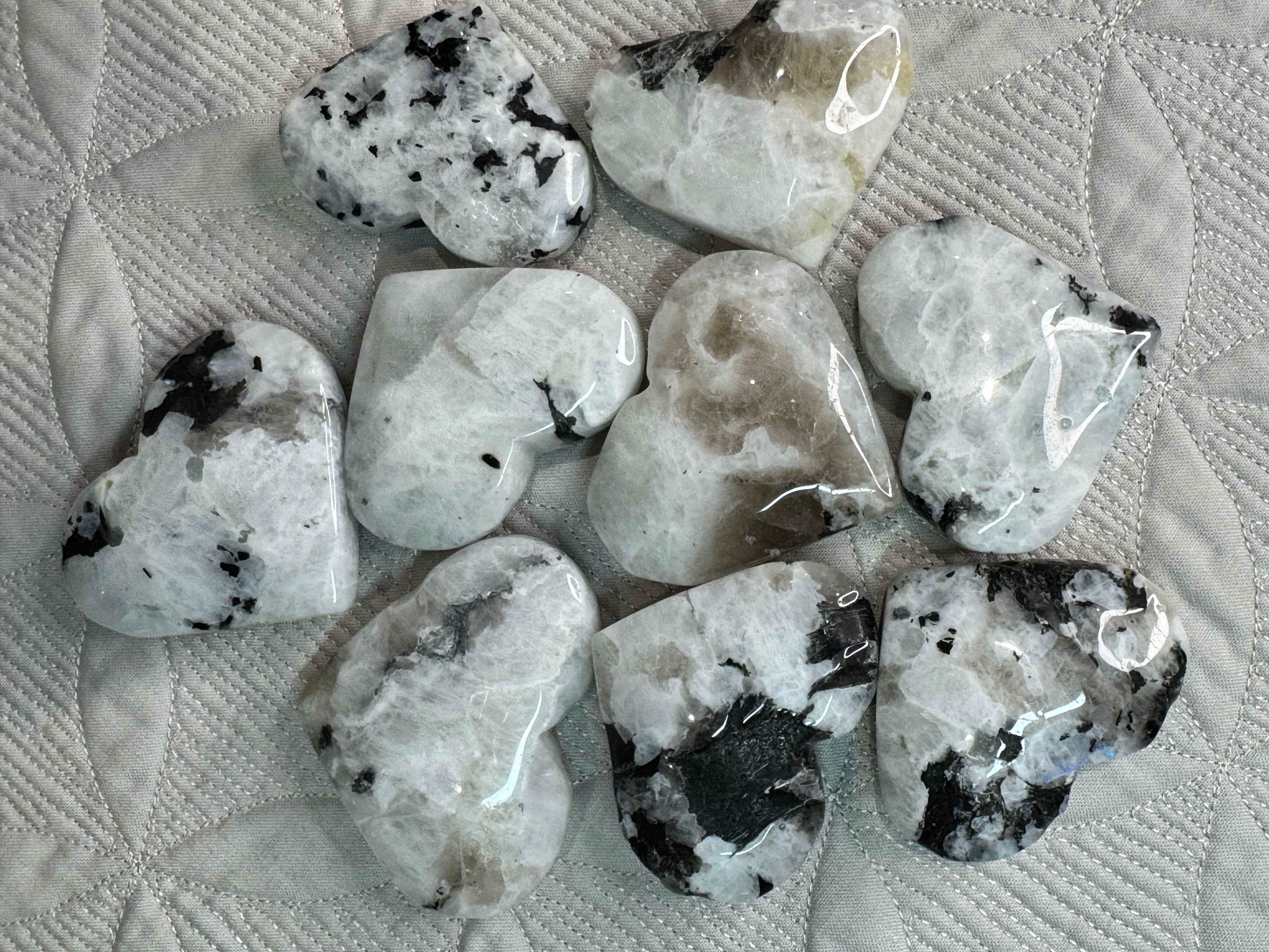 Collection of polished stones on a textured fabric surface
