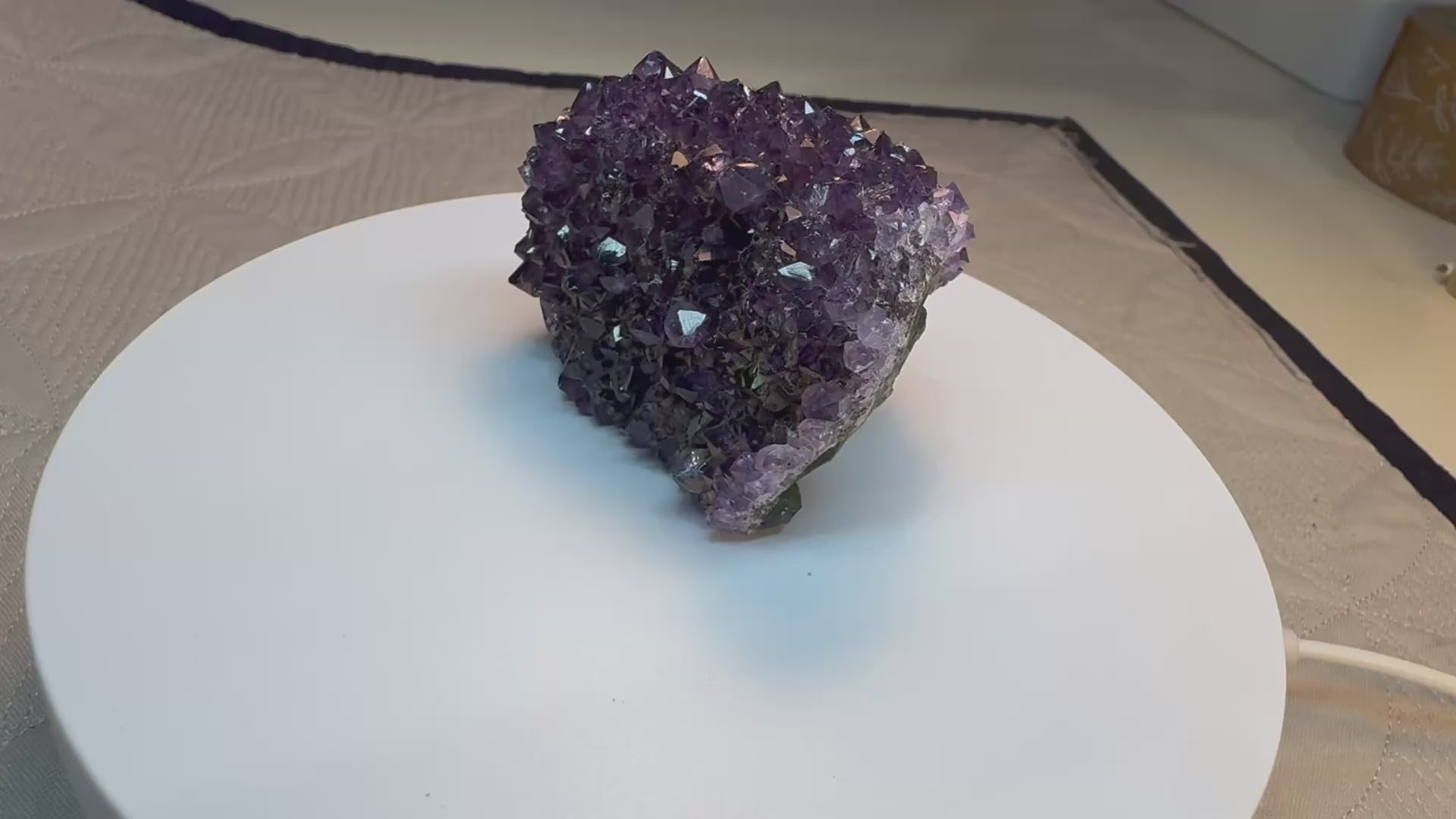 video of purple crystal on a turntable