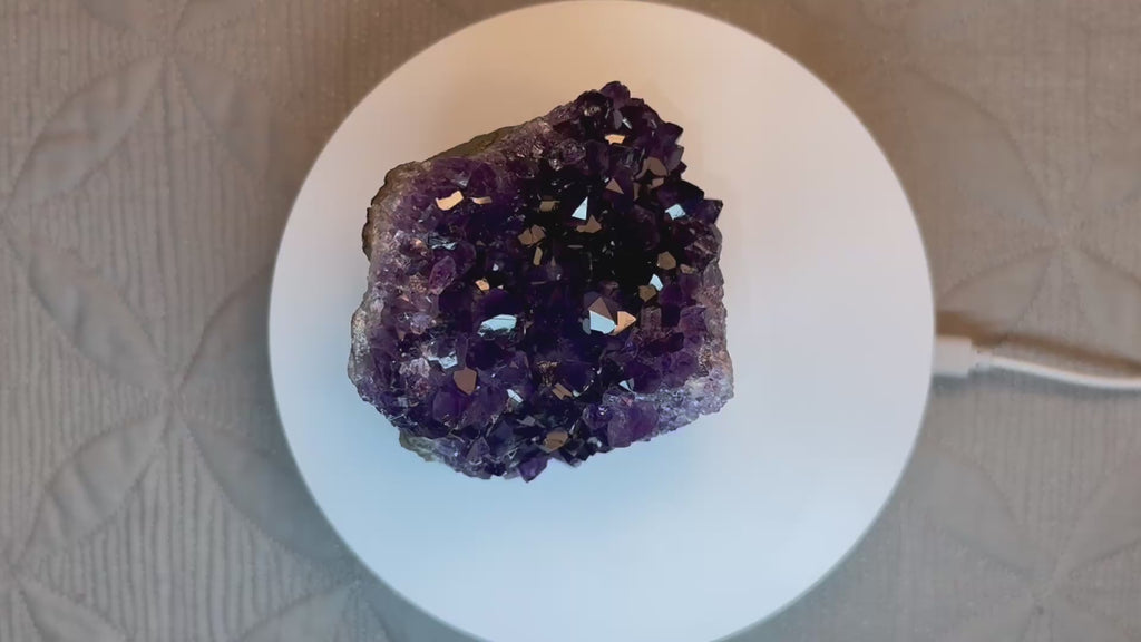 video of purple crystal on a turntable