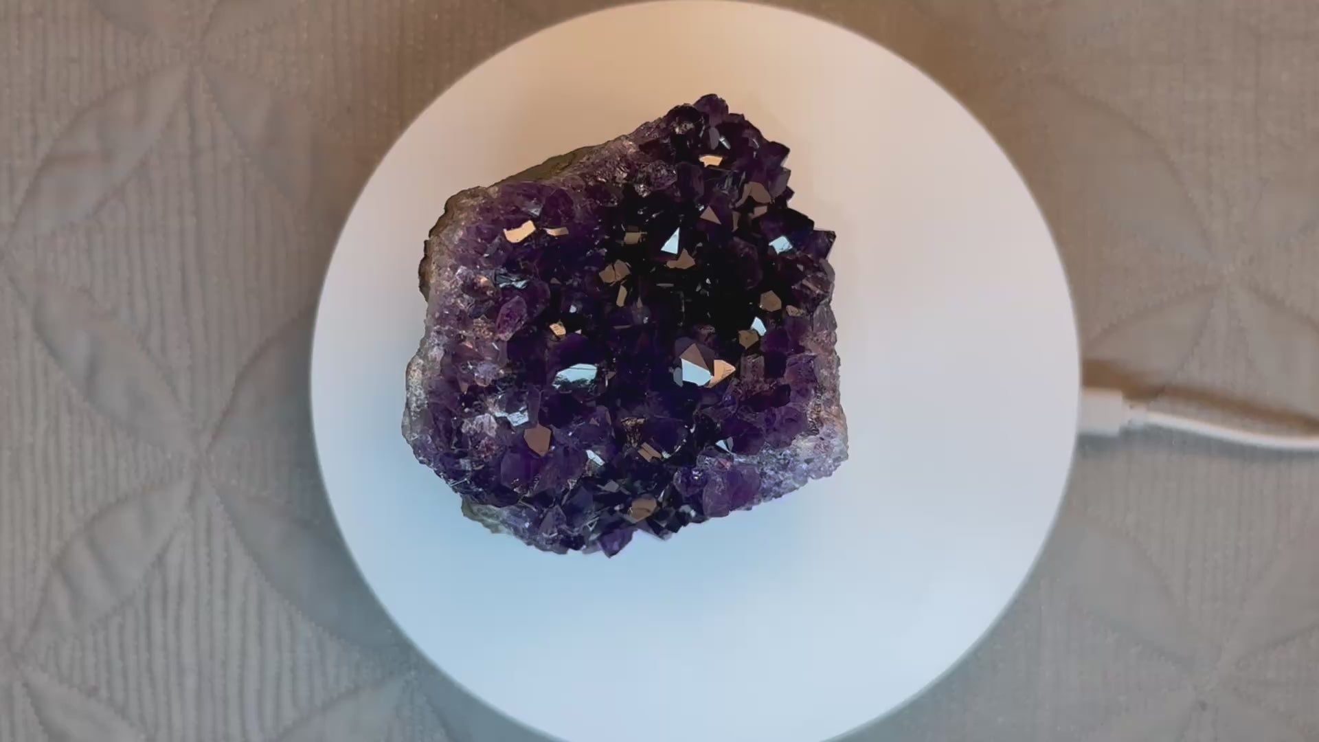 video of purple crystal on a turntable
